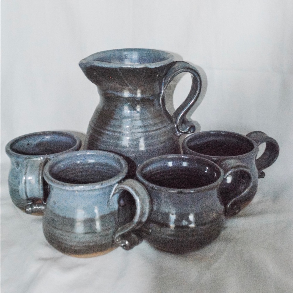 Handmade blue ceramic pitcher and mugs